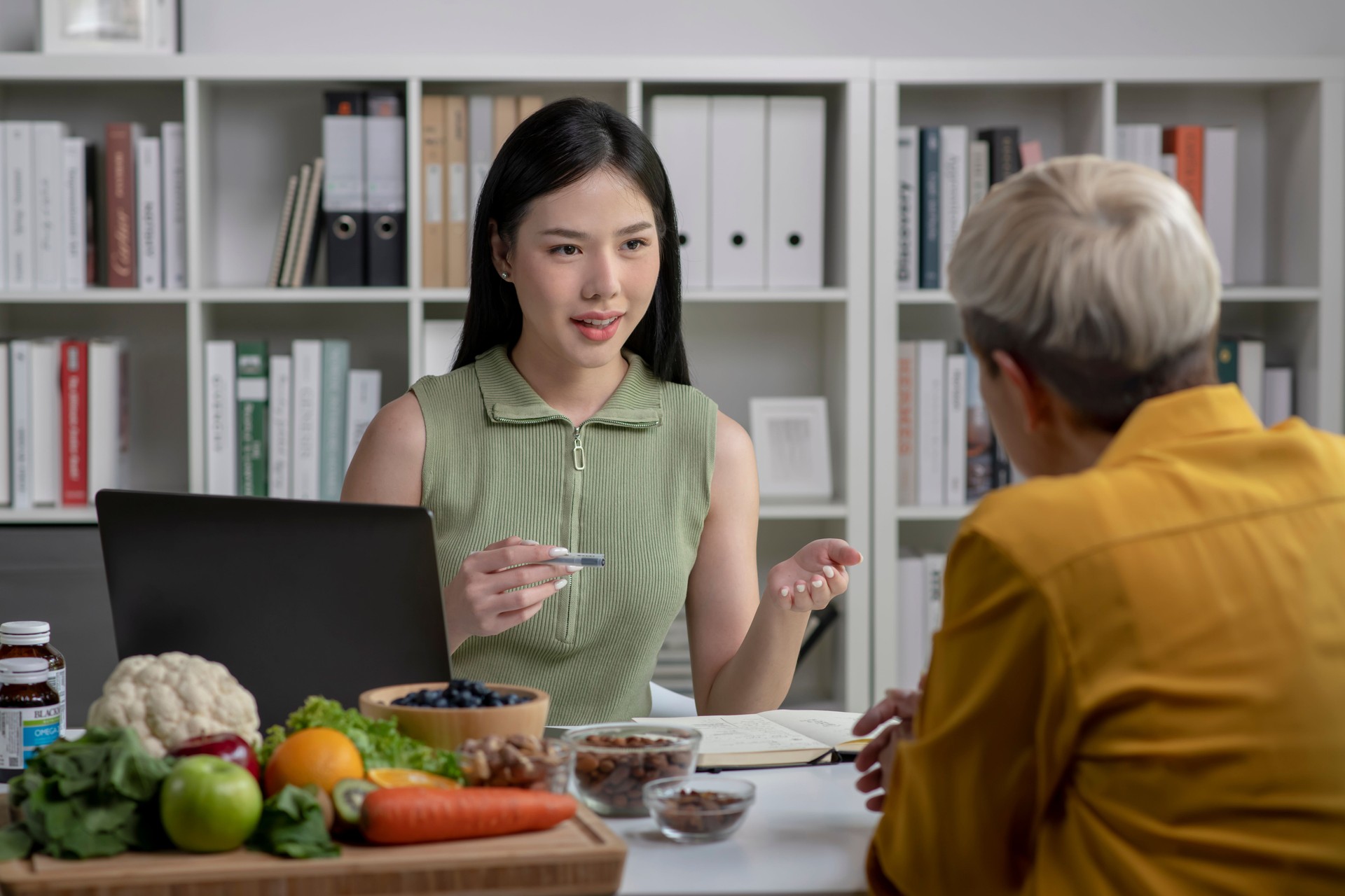 Nutritionist with woman client.   